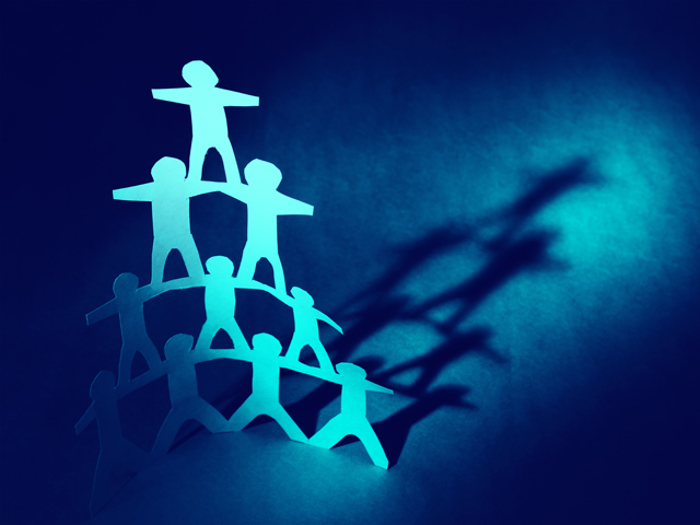 paper cutouts forming human pyramid - all blue